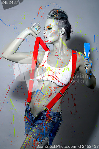 Image of Female House Painter Splattered with Latex Paint