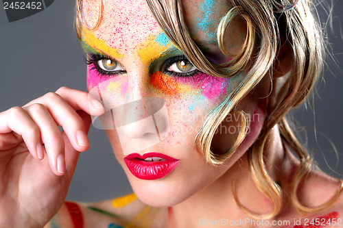Image of Woman With Extreme Makeup Design With Colorful Powder