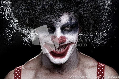 Image of Spooky Clown Portrait on Black Background