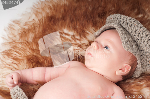 Image of Newborn baby in knitted hat