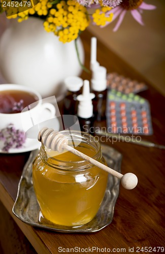 Image of Still life from medicinal herbs, honey, herbal tea and medicines