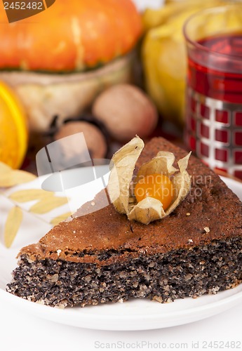 Image of poppy pie, autumn leaves and pumpkins