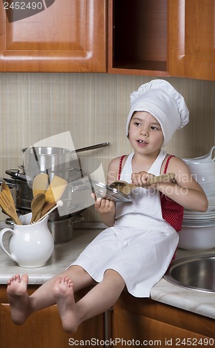 Image of girl in a cap and an apron