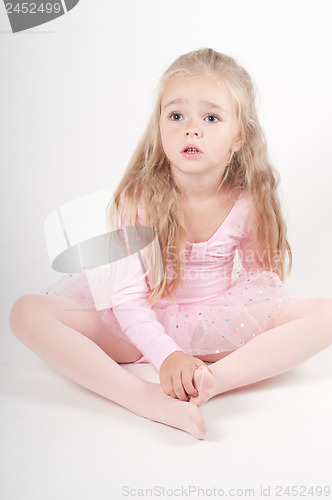 Image of Ballet dancer sitting on the floor
