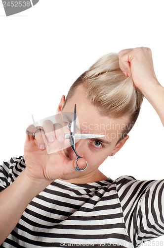 Image of Portrait of handsome man with scissors