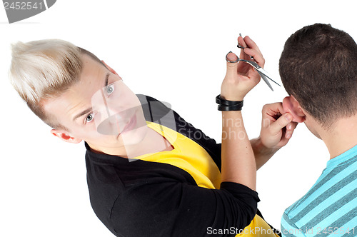 Image of Hairdresser working with scissors