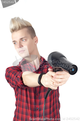 Image of Portrait of handsome man with hairdryer on hands