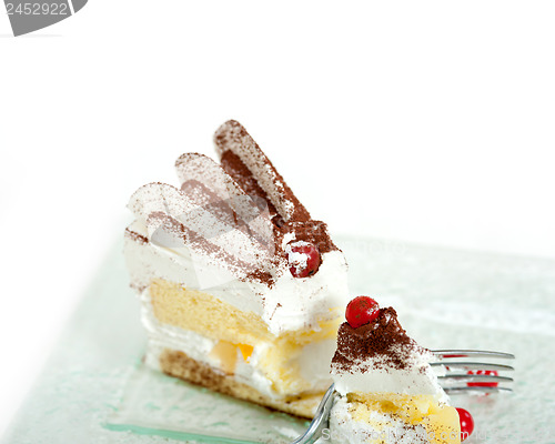 Image of whipped cream and ribes dessert cake slice