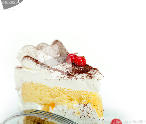 Image of whipped cream and ribes dessert cake slice