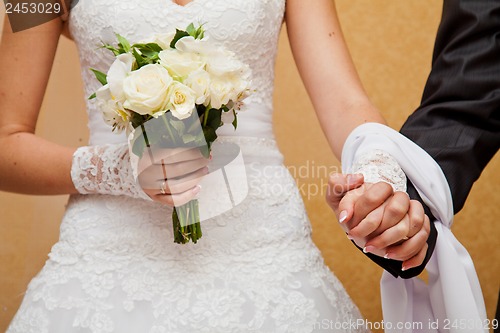 Image of hand with bouquet