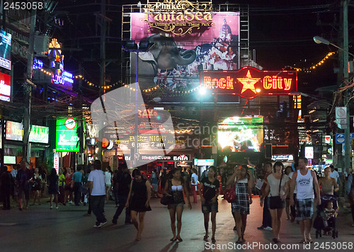 Image of PATONG, THAILAND - APRIL 26, 2012: People walk in the evening on