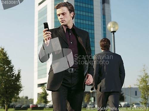Image of Businessman working near office aa