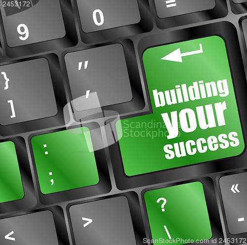 Image of building your success button on computer keyboard key