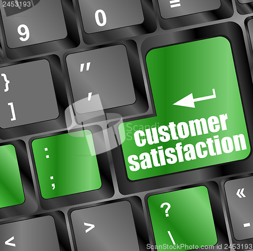 Image of customer satisfaction key word on computer keyboard