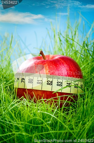 Image of apple and measuring tape