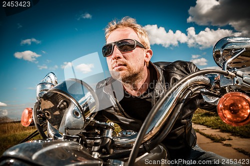 Image of Biker racing on the road