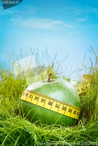 Image of apple and measuring tape