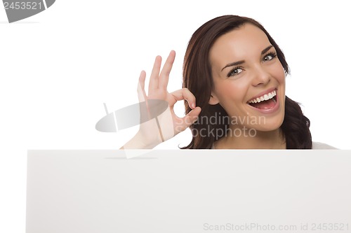 Image of Smiling Mixed Race Female Holding Blank Sign on White
