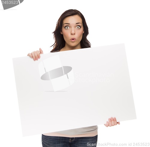 Image of Wide Eyed Mixed Race Female Holding Blank Sign on White
