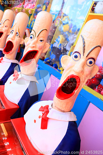 Image of Side show carnival clowns with mouths open ready for play