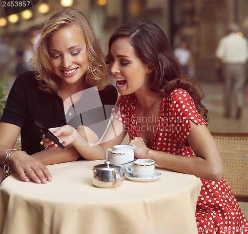 Image of businesswomen with mobile phone kl