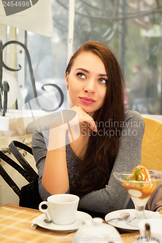 Image of Young thoughtful woman