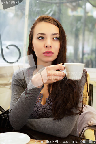 Image of Pretty thoughtful woman