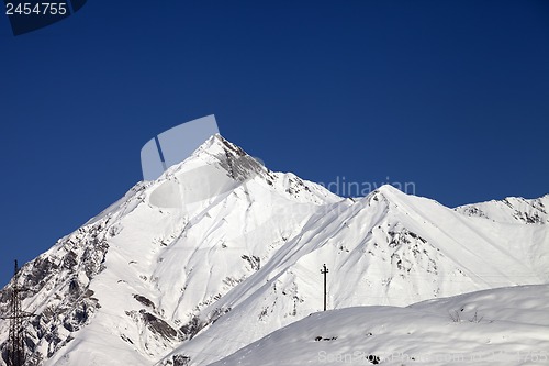 Image of Snowy mountains and blue clear sky in nice day