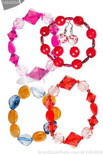 Image of A set of handmade bracelets made of glass on a white background.