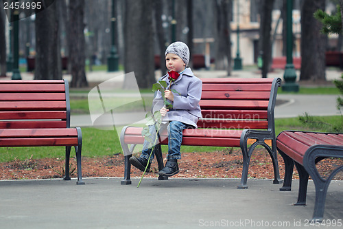 Image of Little boy waiting in the park