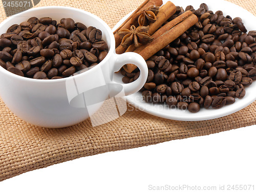 Image of Cup with coffee beans and cinnamon
