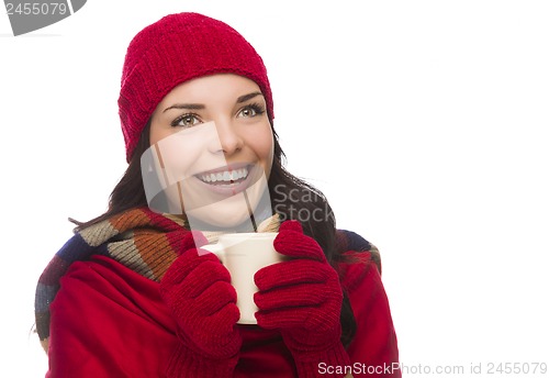 Image of Mixed Race Woman Wearing Mittens Holds Mug Looks to Side