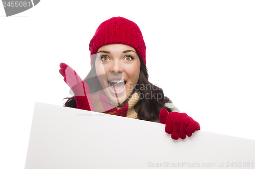Image of Surprised Girl Wearing Winter Hat and Gloves Holds Blank Sign 