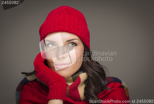 Image of Smiling Mixed Race Woman Wearing Mittens Looks to Side