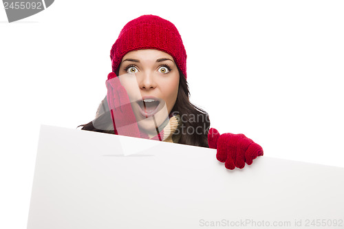 Image of Shocked Girl Wearing Winter Hat and Gloves Holds Blank Sign 