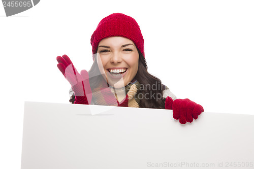 Image of Thrilled Girl Wearing Winter Hat and Gloves Holds Blank Sign 