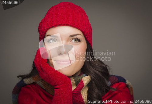 Image of Mixed Race Woman Wearing Mittens Looks to Side