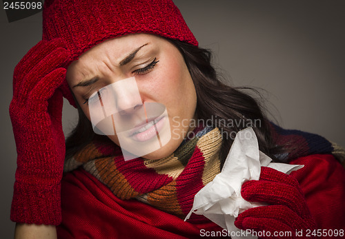 Image of Miserable Mixed Race Woman Blowing Her Sore Nose with Tissue