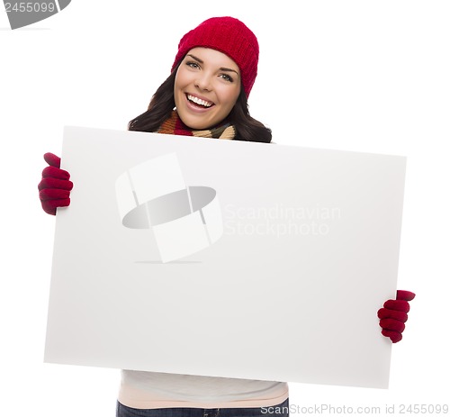 Image of Excited Girl Wearing Winter Hat and Gloves Holds Blank Sign 