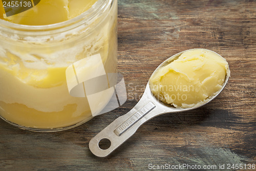 Image of ghee in jar and spoon