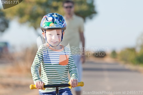 Image of family biking
