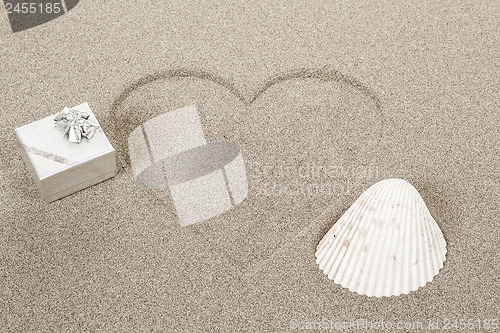 Image of Heart shape symbol drawn in sand