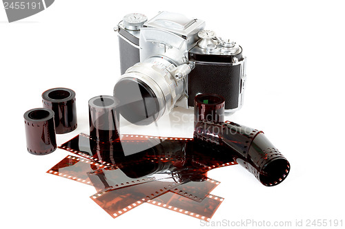 Image of analog vintage SLR camera and color negative films