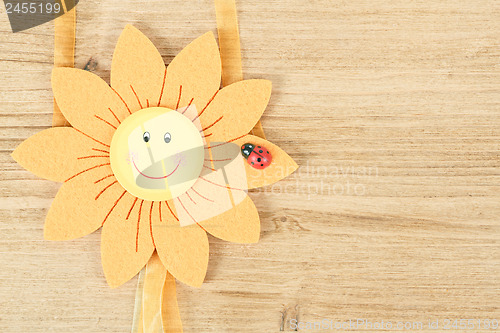 Image of wooden board for spring message with flowers