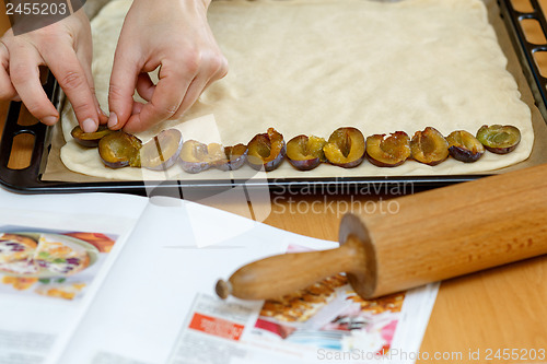 Image of preparing, baking plum cake