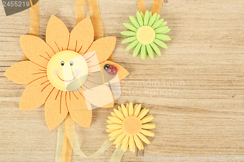 Image of wooden board for spring message with flowers