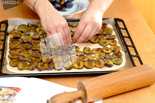 Image of preparing, baking plum cake