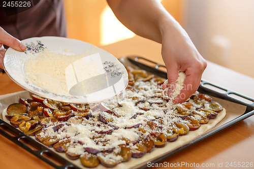 Image of preparing, baking plum cake