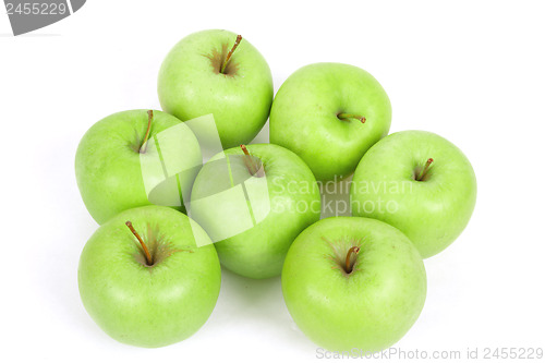 Image of seven green apples isolated on a white background 