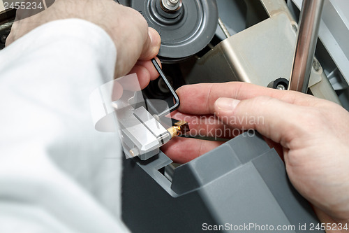 Image of man repairs device